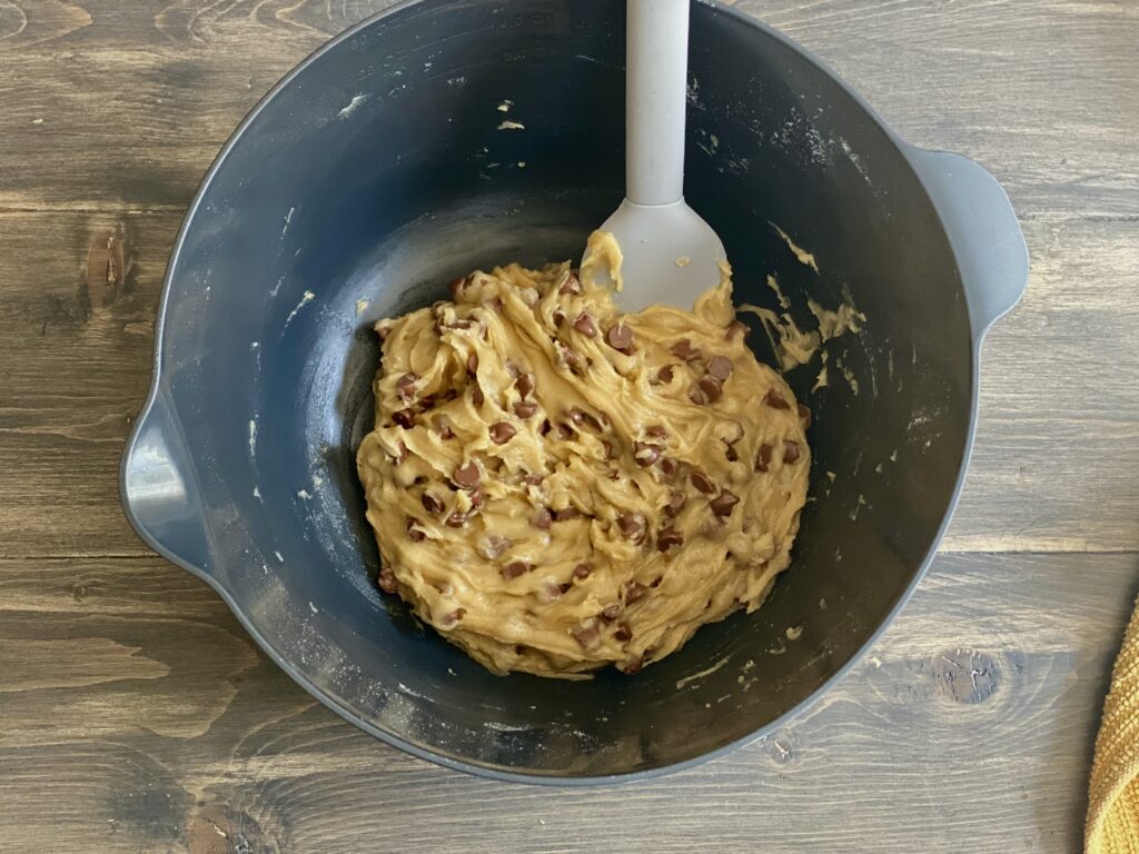 Adding the chocolate chips to the cookie dough