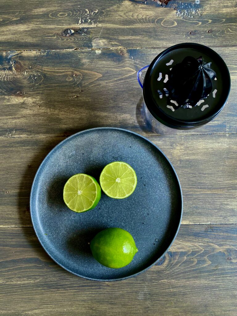 Limes cut in Half by juicer.