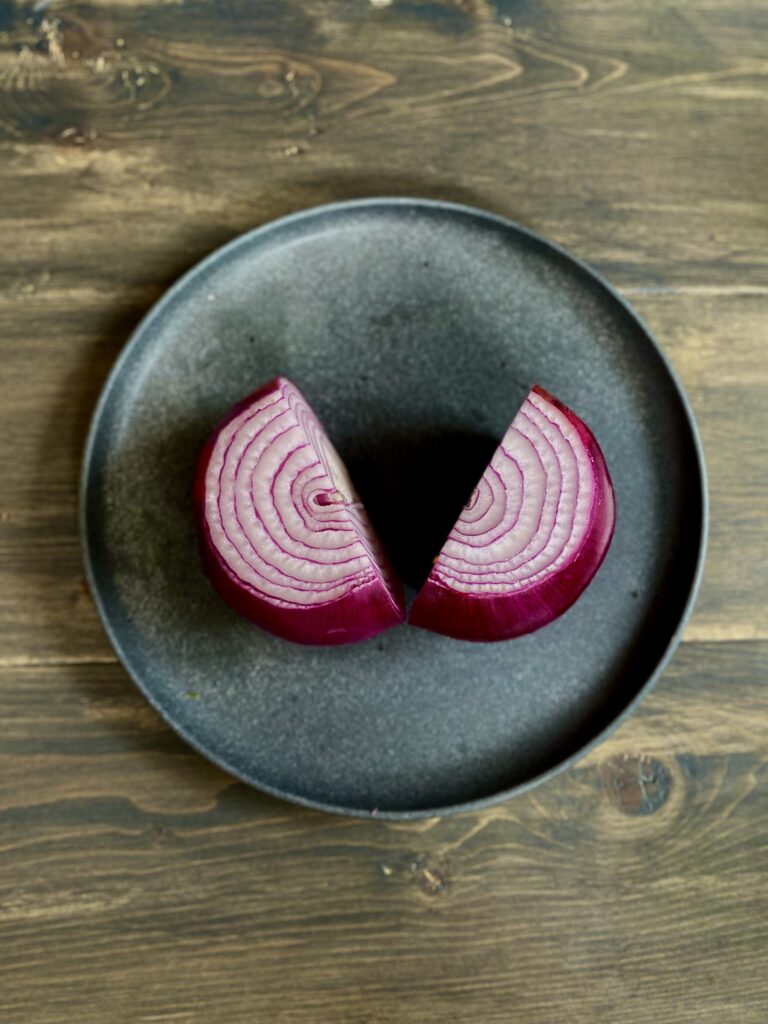 Red onion cut in half.