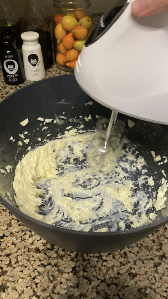 Mixing butter until smooth.