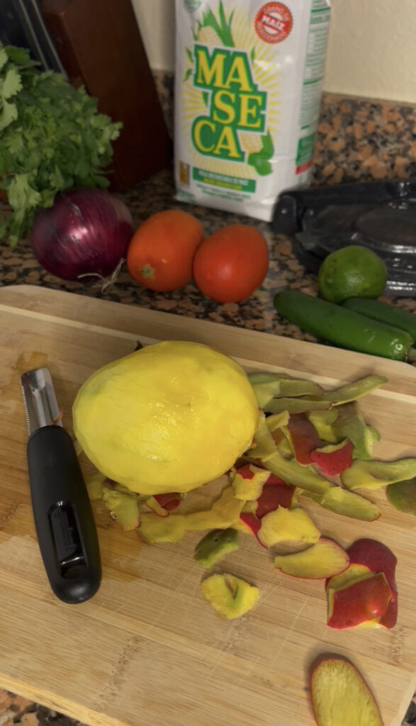 Peeled mango that is a bright yellow.