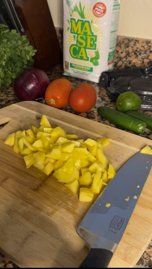 A mango that has been diced into little cubes.