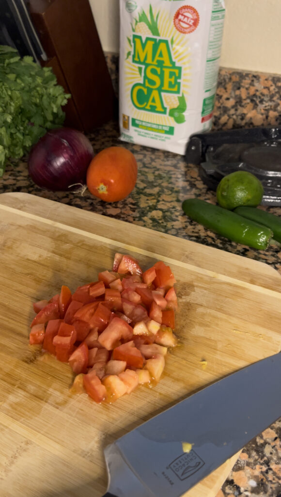 A roma tomato diced up finely.