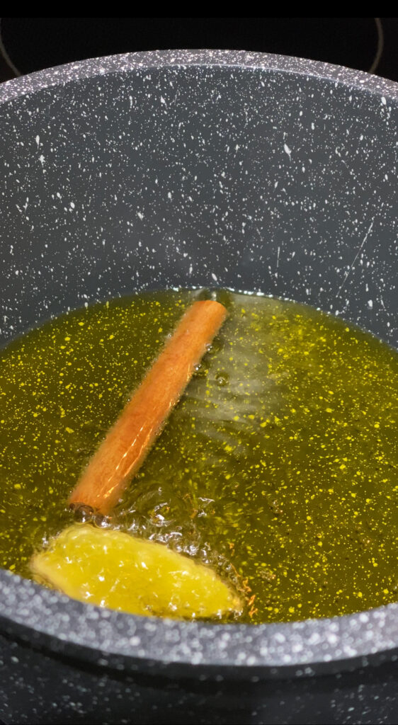 Cinnamon Stick and Slices of Ginger in Hot oil