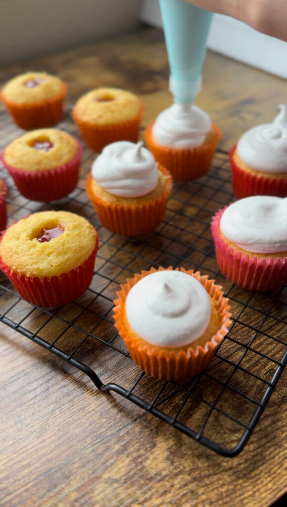 Piping Hi-Hat Frosting on Yellow Cake CupCakes.