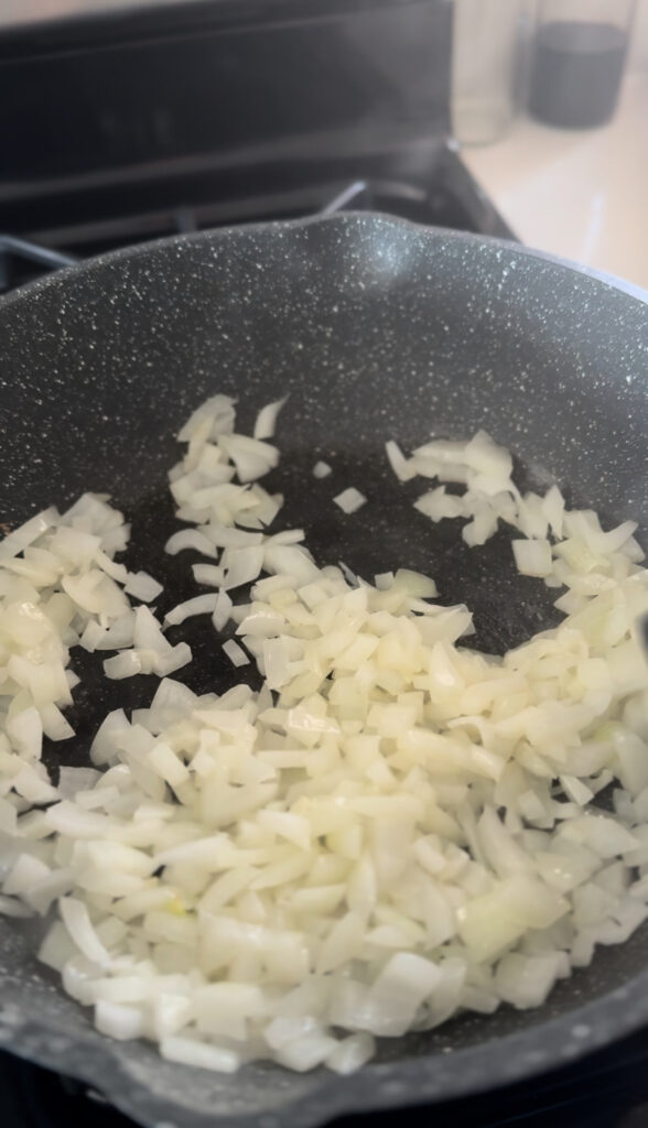 diced onion in frying pan with butter for chicken paprikash