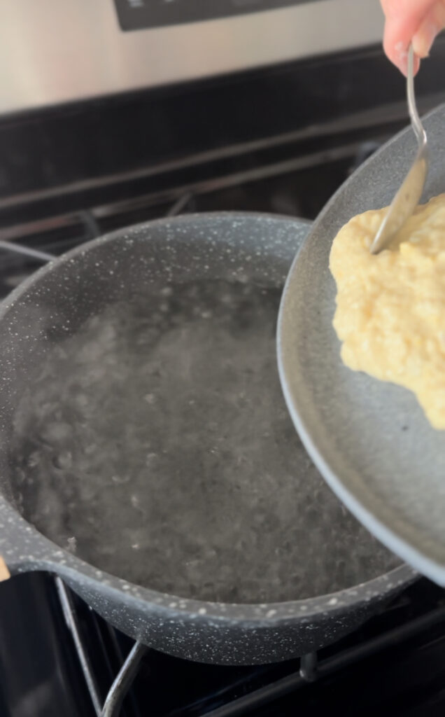 dumpling mixture on a plate to scrape