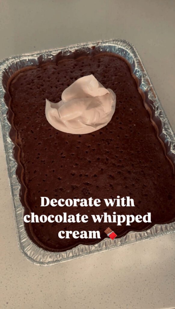 Decorating cake with chocolate whipped cream