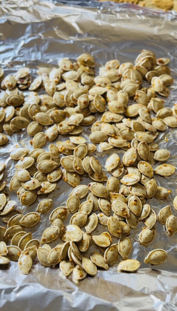 Seasoned pumpkin seeds waiting to be baked