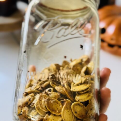 Roasted pumpkin seeds in a mason jar