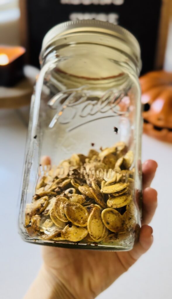 Roasted pumpkin seeds in a mason jar