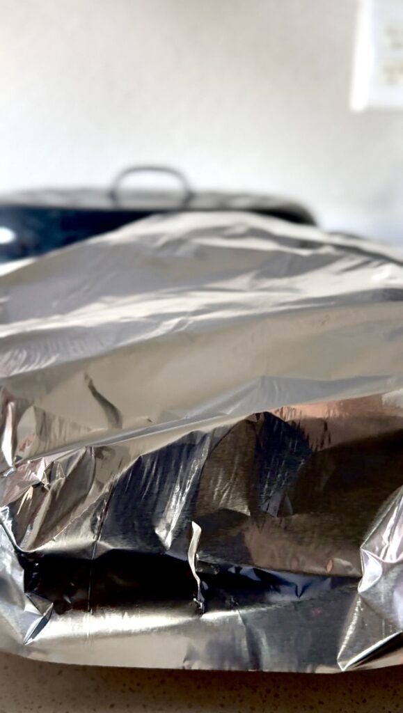 Cover the dish with foil to keep steam in.