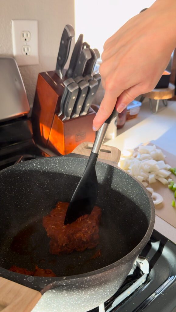 Cooking chorizo for Sopa De Chorizo Con Papas: Chorizo and Potato Soup