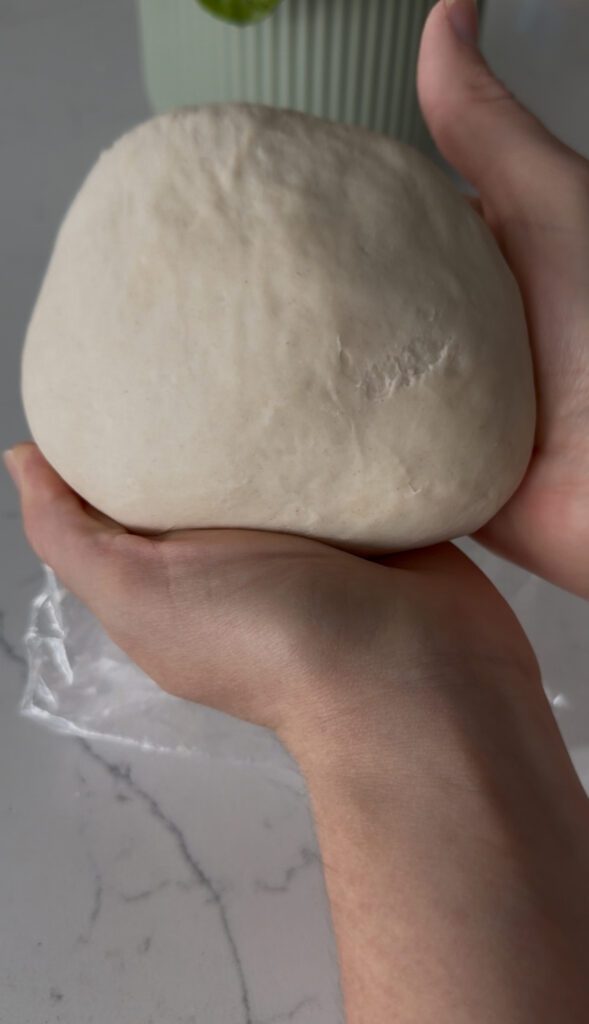 Folded dough into ball