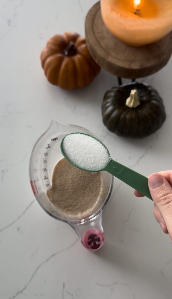 Sugar being added to yeast and warm milk