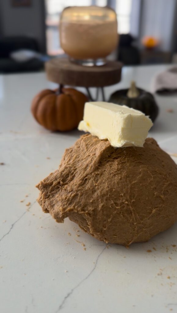 Adding butter to the dough