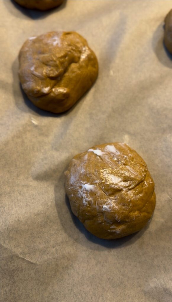 Butter on top of the dough balls