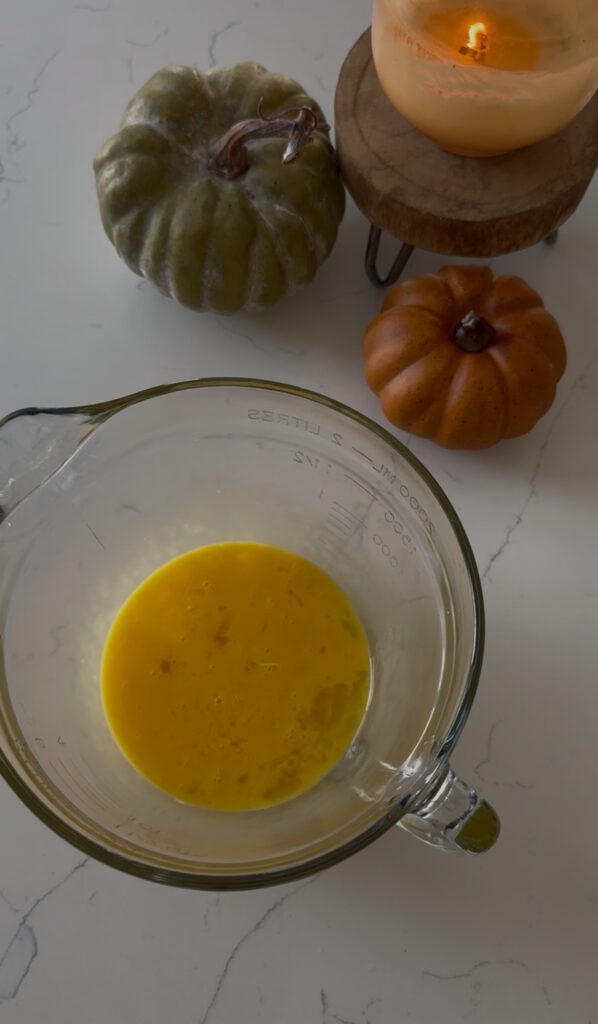 five eggs whisked slowly for flan