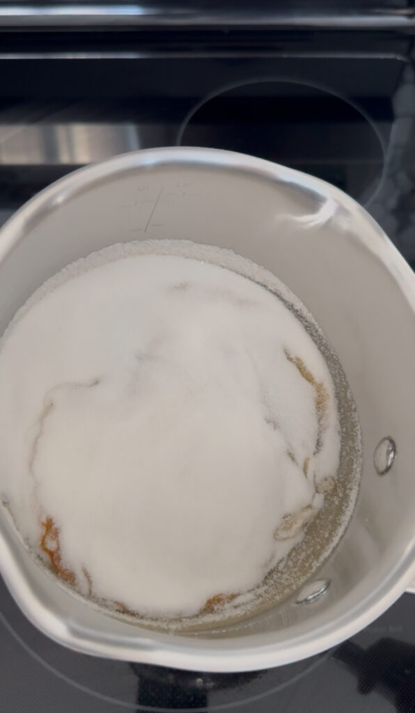 White sugar in a pan over medium heat- to make caramel glaze on the flan