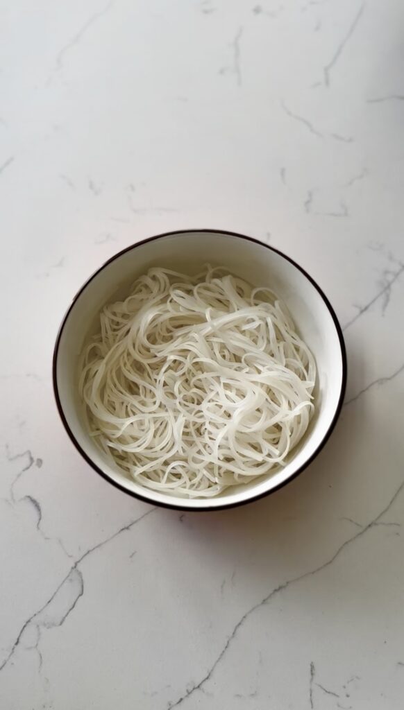 plain pho noodles in a bowl waiting for toppings