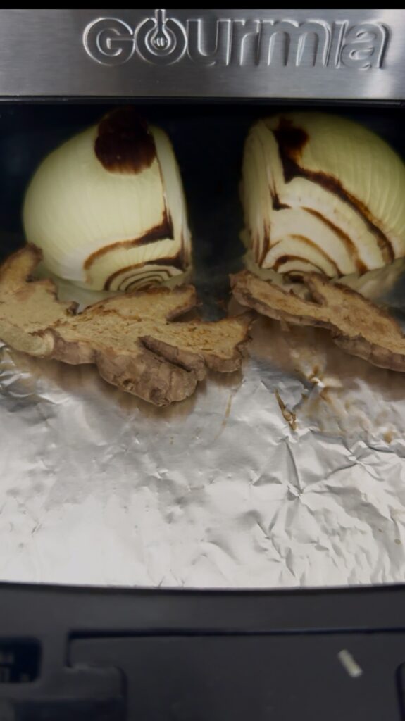 charred onion and ginger in an air fryer