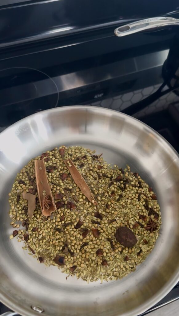 pho seasonings being toasted in a pan