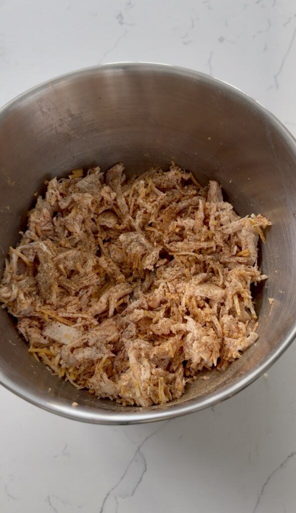 Enchilada mixture. Cheese, chicken, and red sauce