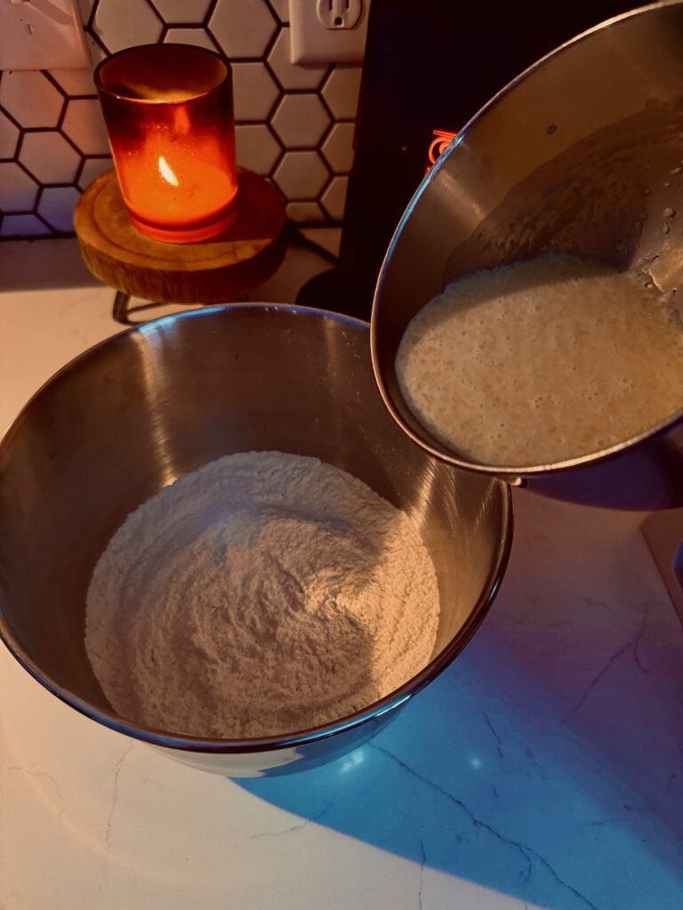 slowly pouring wet ingredients into dry ingredients