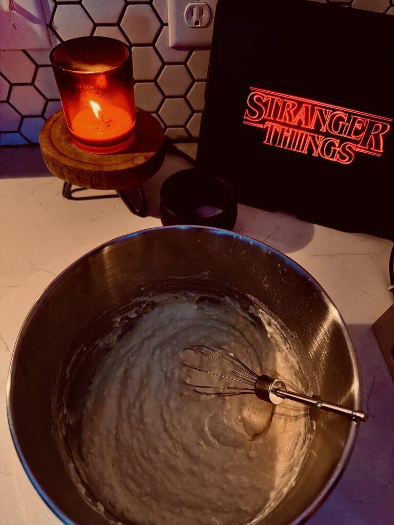 mixing together the wet and dry ingredients