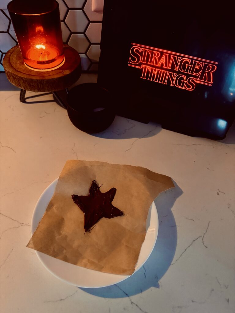 forming melted chocolate into a star shape