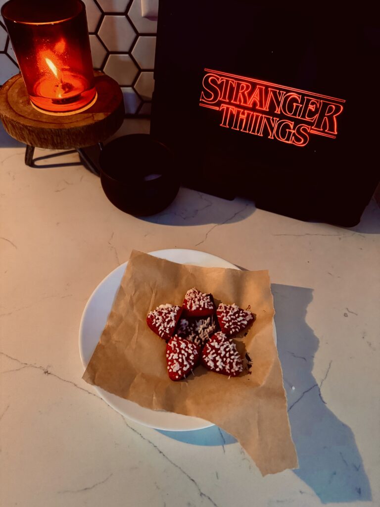 finished product of the demogorgan strawberries showing off the icing teeth and chocolate