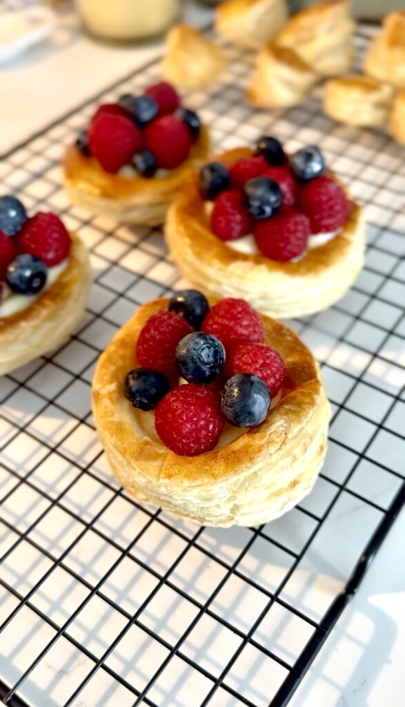 decorating puff pastry with berries