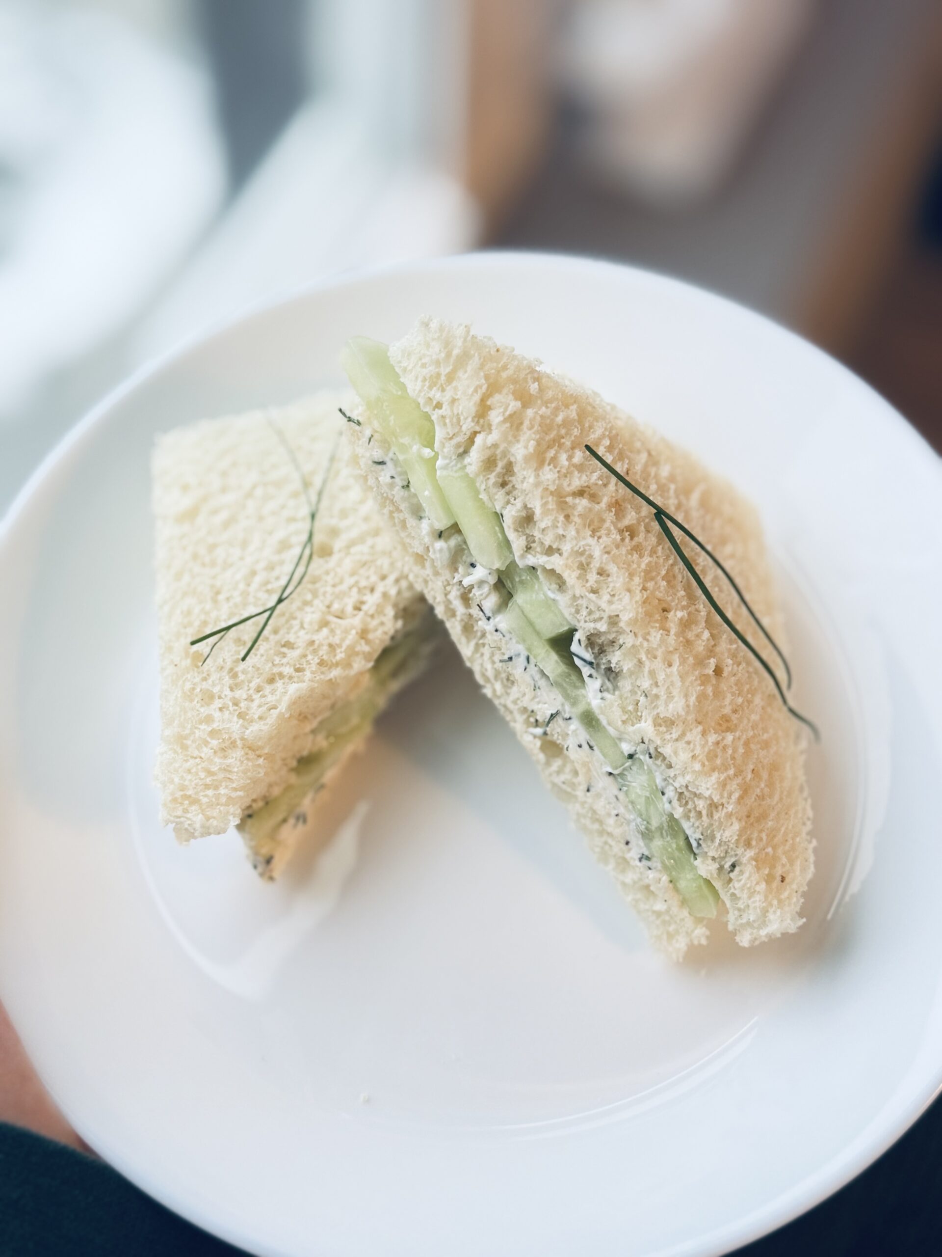 Cucumber tea sandwich placed neatly on a plate