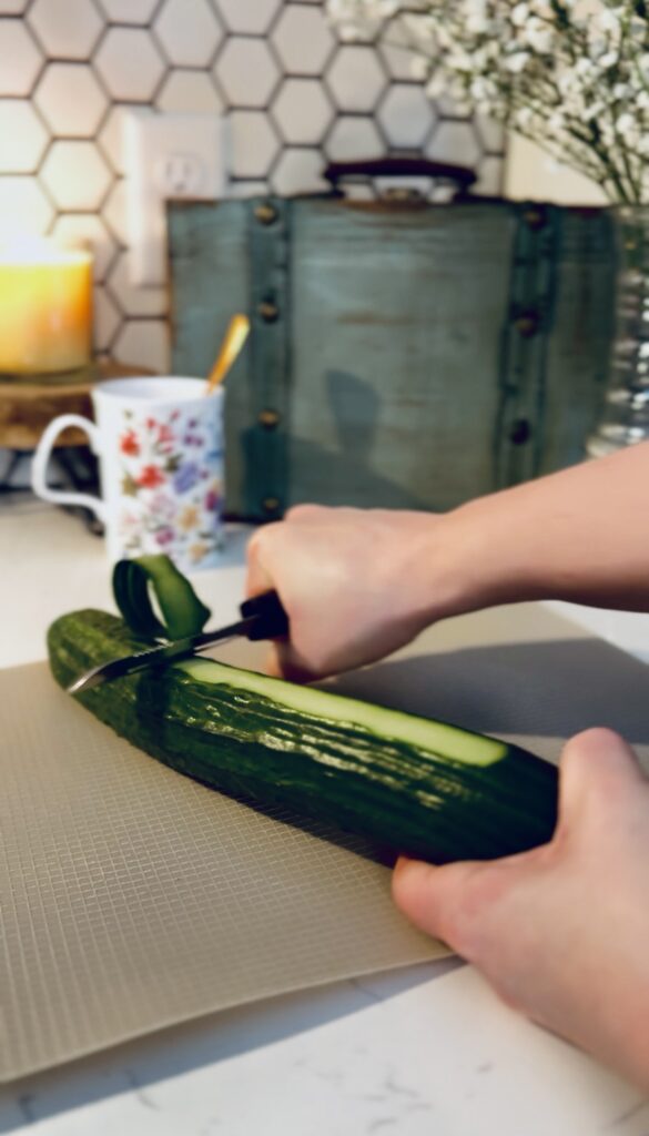 Peeling the skin off of an english cucumber