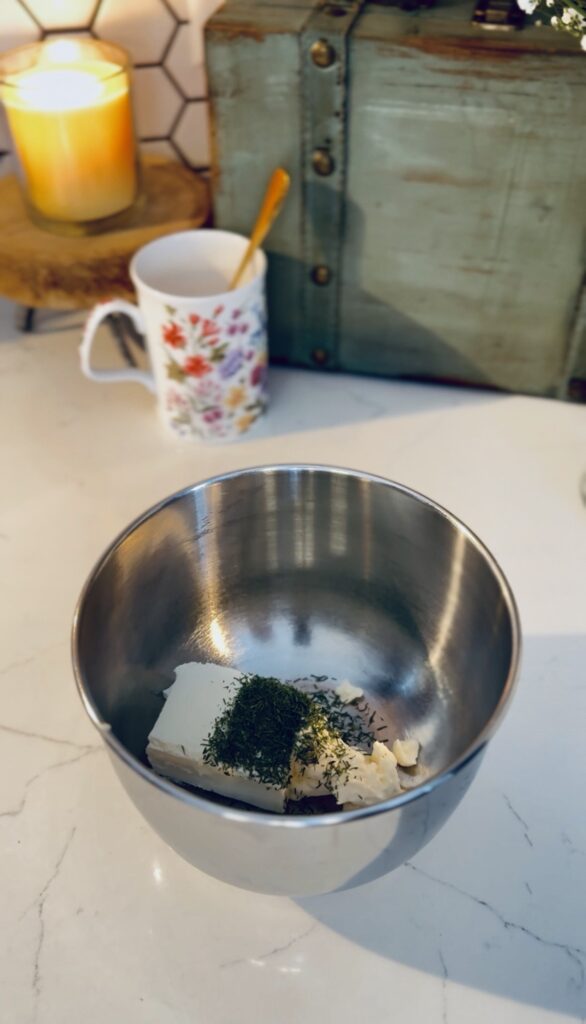 Cream cheese and spices in a bowl