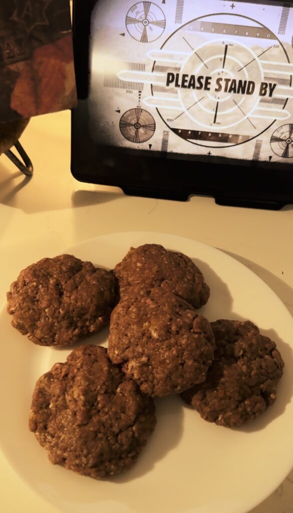 Five beef patties on a plate.
