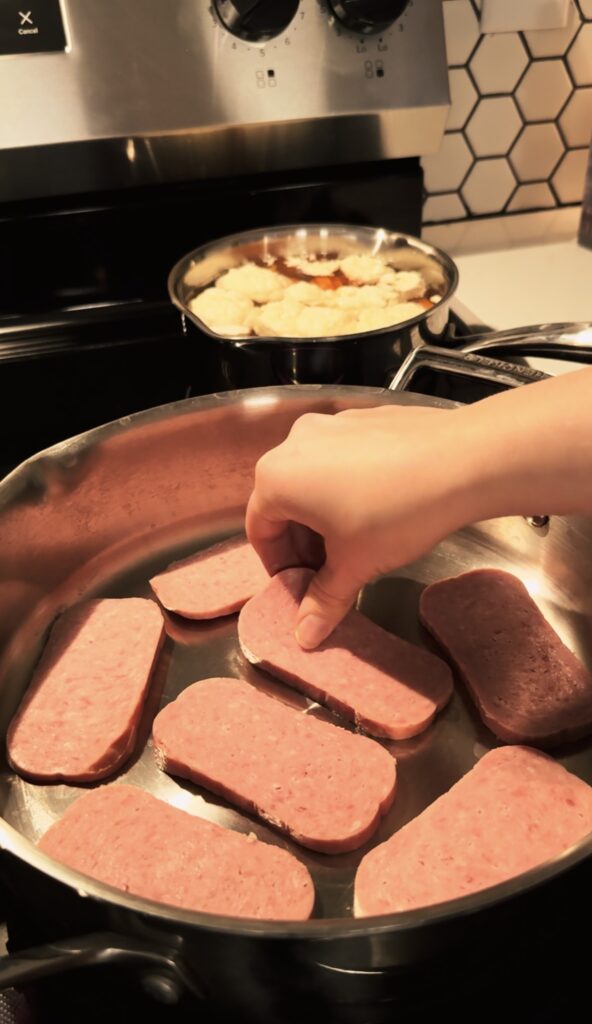 frying the spam in a pan