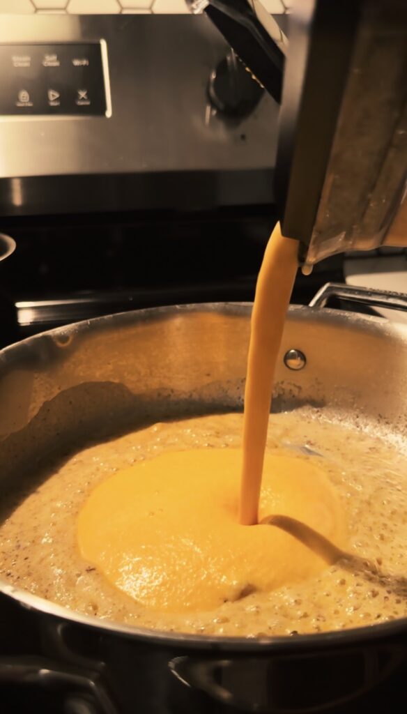 Adding creamy veggies sauce to the pan